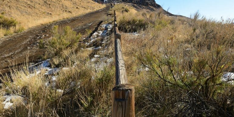 Rustic fence next to a hiking path on a day trip from Denver to Golden Colorado