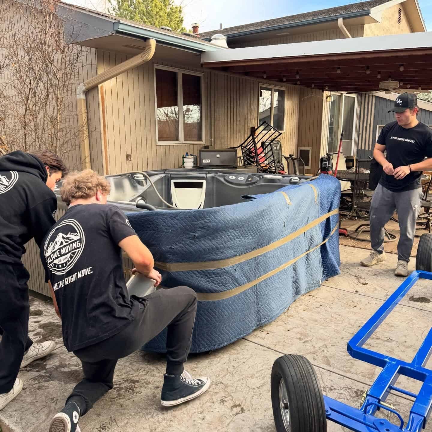 local movers moving a hot tub at a house