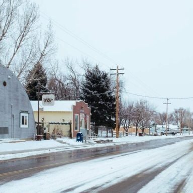 Snowy small town street with buildings